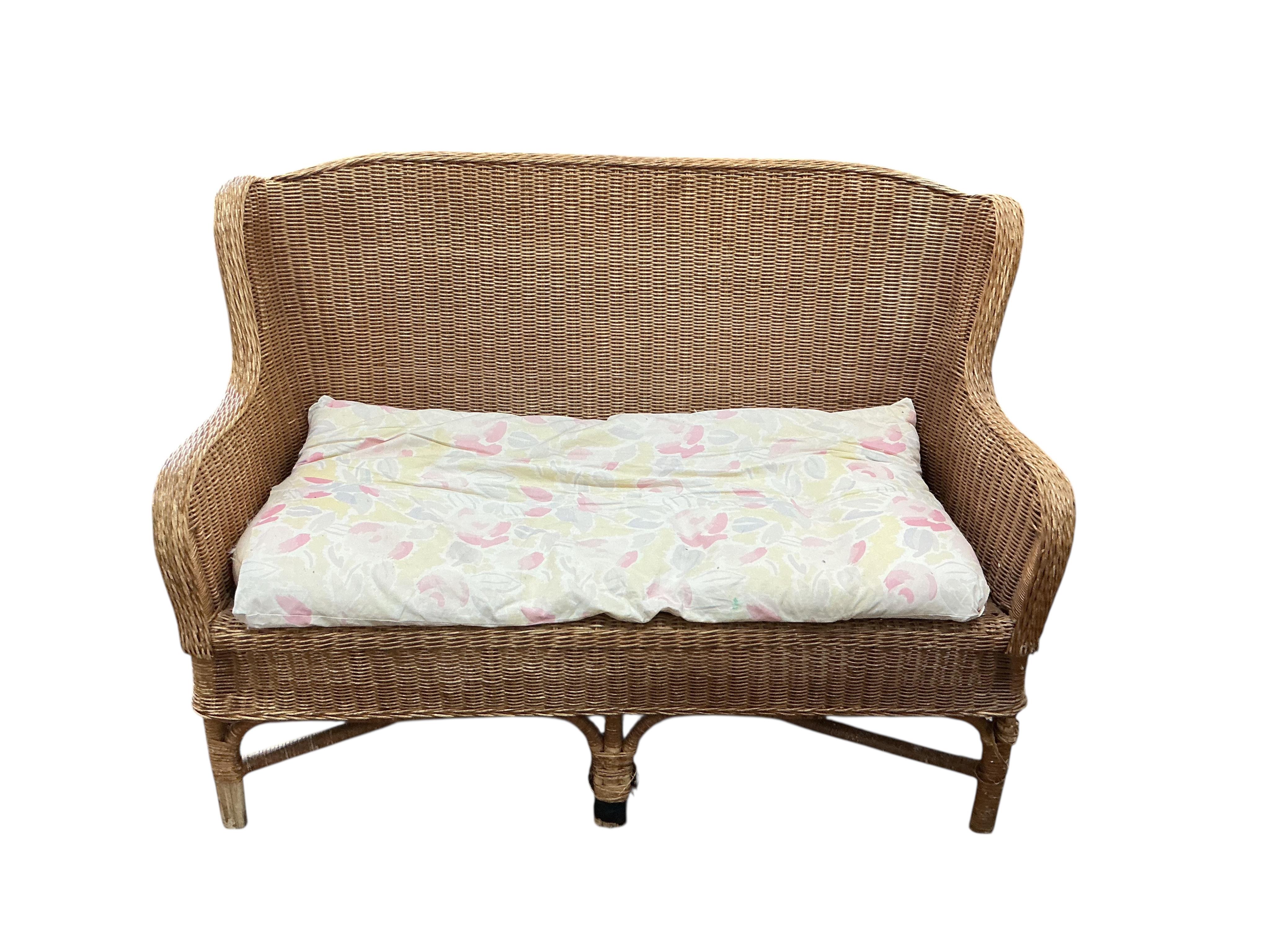 A cane conservatory settee, width 130cm, depth 66cm, height 90cm